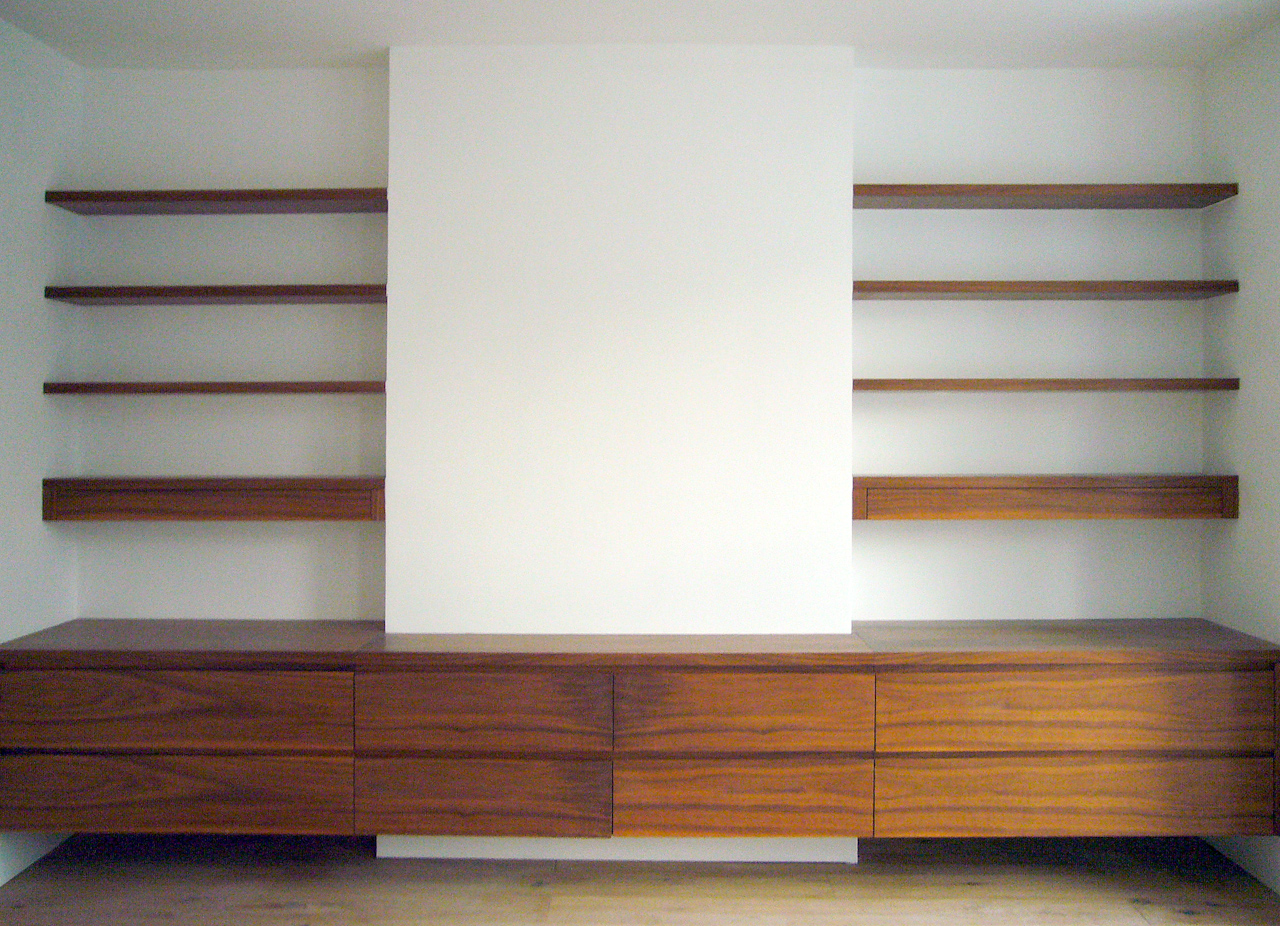 Contemporary alcove unit in a dark stained oak. Recessed finger 